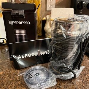 Nespresso milk frother new in box.
